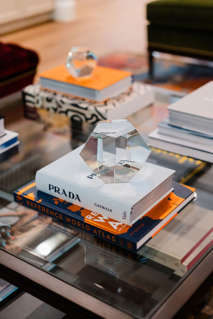 Prada coffee table book sits under a clear glass hexagon | Personal branding photoshoot for realtor Marianne Mansour